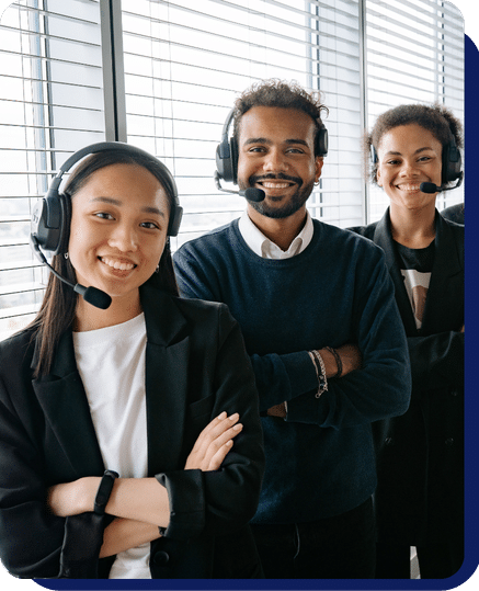 A group of staff standing and smile