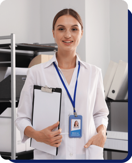 Healthcare worker with identification badge holding a clipboard in an hospital