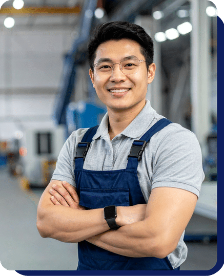 A person standing in facility and smile