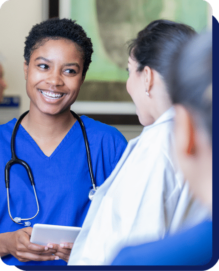 Nurse talking to another nurse with smiling on face