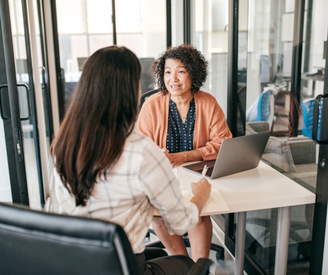 Professional conducting job interview with candidate in office meeting room